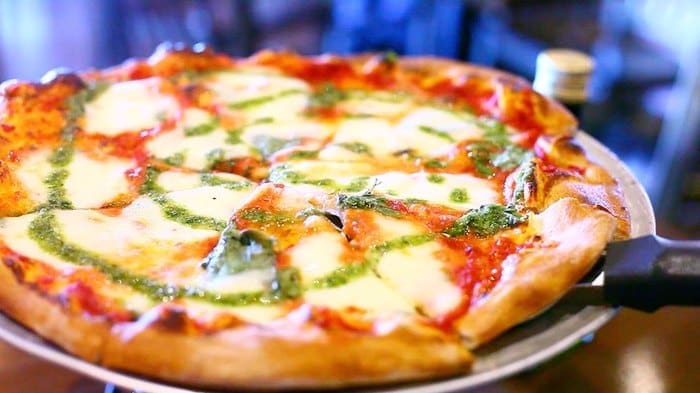 A pizza on a plate

Description automatically generated