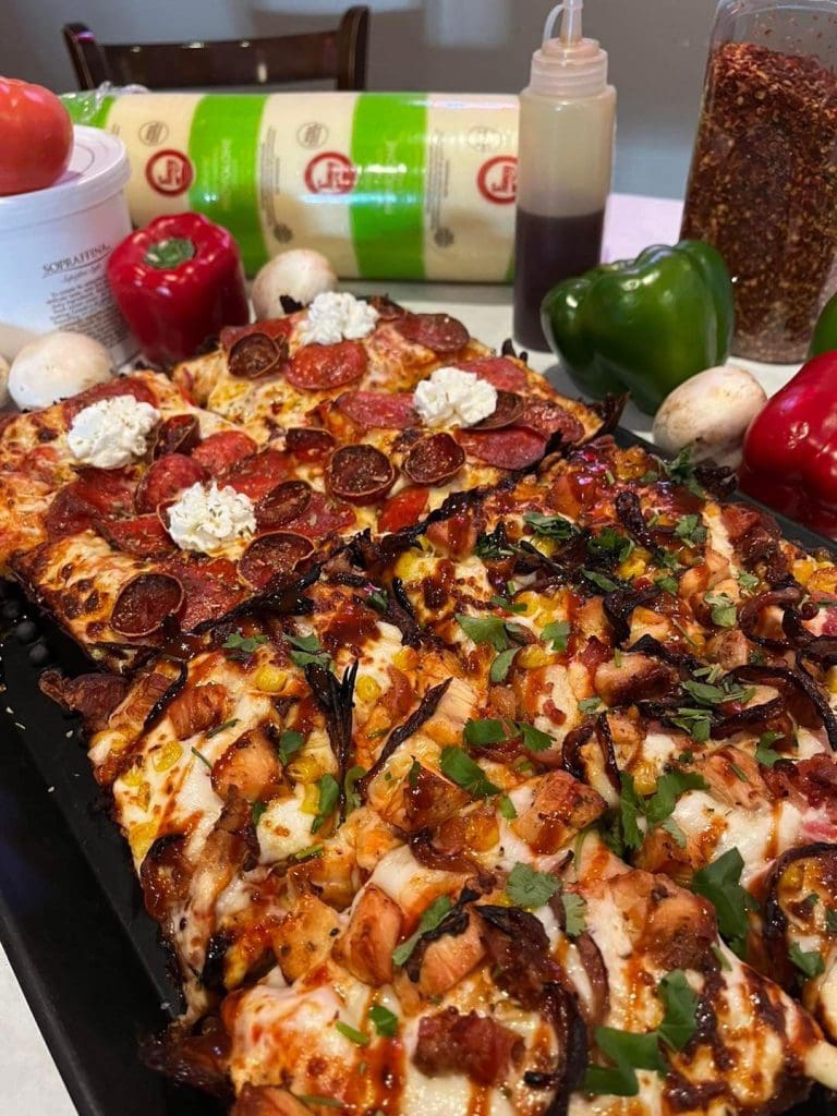 A pizza on a table Description automatically generated