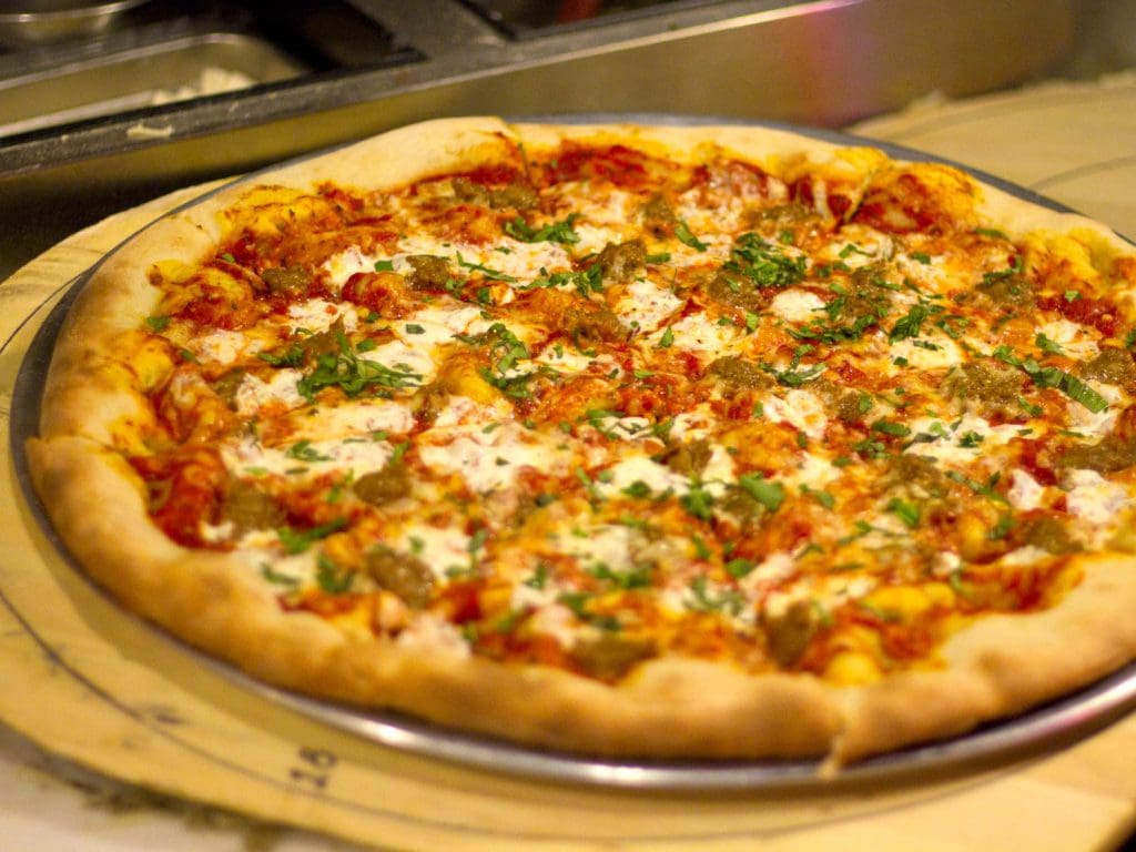 A pizza on a tray

Description automatically generated